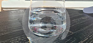 Glass of clean cold water on table in a cafe