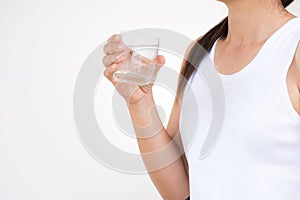 A glass of clean mineral water in woman`s hands. i