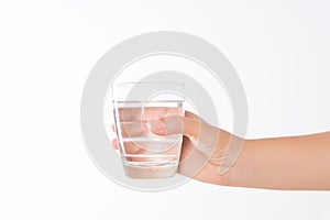 A glass of clean mineral water in woman`s hands. Concept of environment protection, healthy drink and healthcare