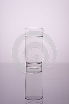 glass of clean water on a gray white background