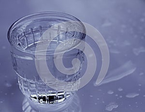 Glass of clear drinking water on a table no people stock photo