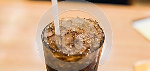 glass with coca cola and ice close-up.