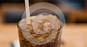 glass with coca cola and ice close-up.