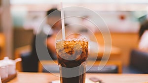 glass with coca cola and ice close-up.