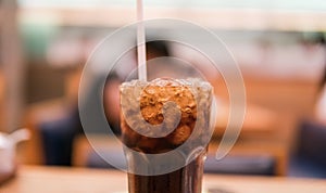 glass with coca cola and ice close-up.