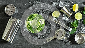 Glass cocktail lime, mint, ice. Drink making bar tools shaker