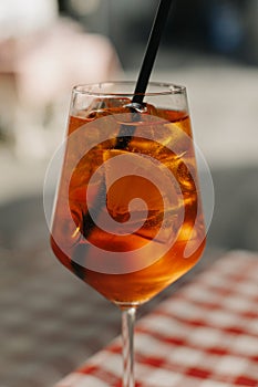 Glass with cocktail on the table in a traditional Italian restaurant