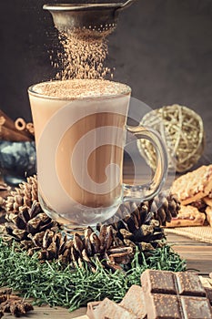 Glass cocoa mug or coffee with milk froth