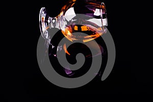 glass with cognac on a black background