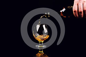 glass for cognac on black background