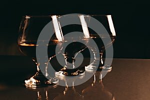 Glass of cognac on a dark background