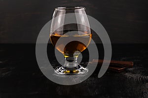 A glass of cognac and dark chocolate