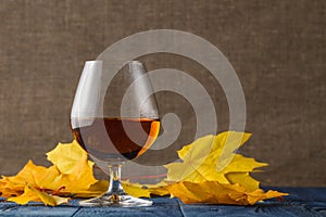 Glass of cognac, Thanksgiving or autumn table setting.