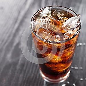 Glass of cola with ice and copyspace in compositio