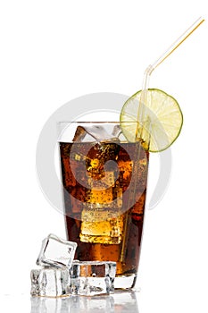 Glass of cola with ice cubes, lime and straw on white backgroun