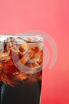 A glass of cola soft drink with ice cubes