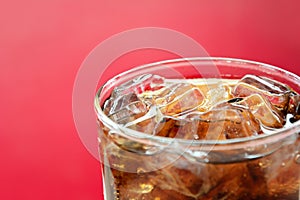 A glass of cola soft drink with ice cubes