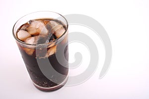 Glass of cola on a white blackground