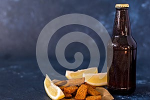 Glass of cold beer on gray stone background