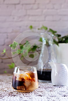 Glass of cold brew coffee with milk