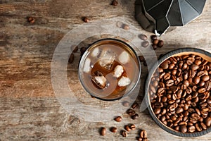 Glass with cold brew coffee on wooden background