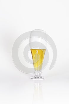 Glass of cold lager beer with foam