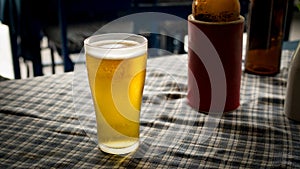 Glass of cold light beer on table freshness and refreshing beverages