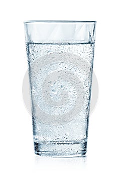 Glass of cold sparkling water with drops