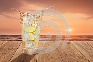 Glass of cold splashing lemonade