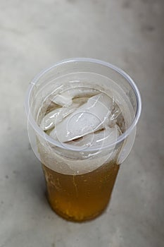 a glass of cold tea in the daylight