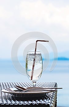 Glass of cold water on dining table on the island