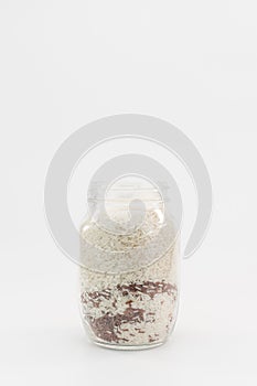 glass container with white and brown rice