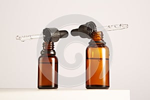 Glass containers of different sizes with pipettes. photo