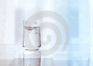 Glass of Cool fresh drink with ice cube on the table