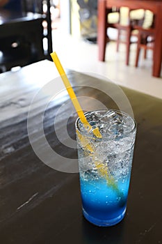 Glass cool ice water blue lemon juice on table for drink fresh