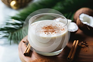 Glass of Coquito or Puerto Rican Eggnog traditional Christmas drink with coconut milk and spices