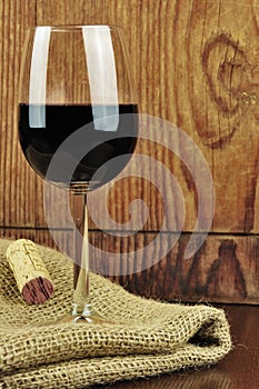 Glass and cork of fine italian red wine