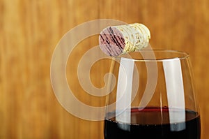 Glass and cork of fine italian red wine
