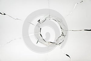 glass crack hole from a ball on a white background