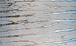 Glass with cracked gray paint. Background texture closeup