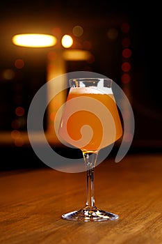 Glass of craft beer on a table in pub