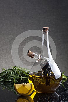 A glass cruet with olive oil and balsamic vinegar photo