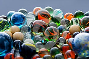 Glass, crystal marbles on grey