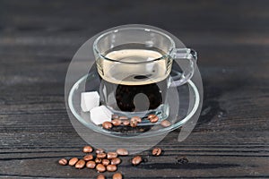 Glass cup with black coffee poured.