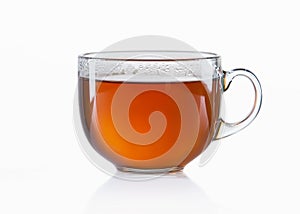 Glass cup of black tea on white background