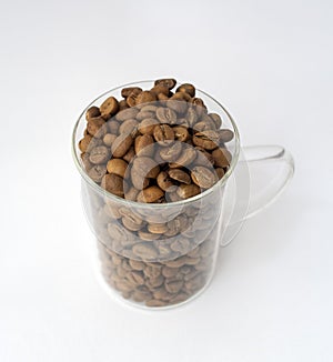 Glass cup of coffee beans