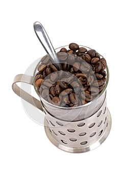 Glass cup with coffee and beans isolated on white