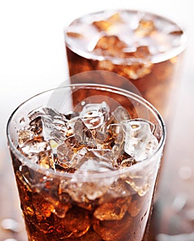 Glass cup of cola soda with ice