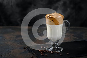 Glass cup with Dalgona frothy coffee trend korean drink latte espresso with coffee foam