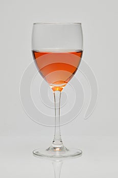 Glass cup with rose wine
